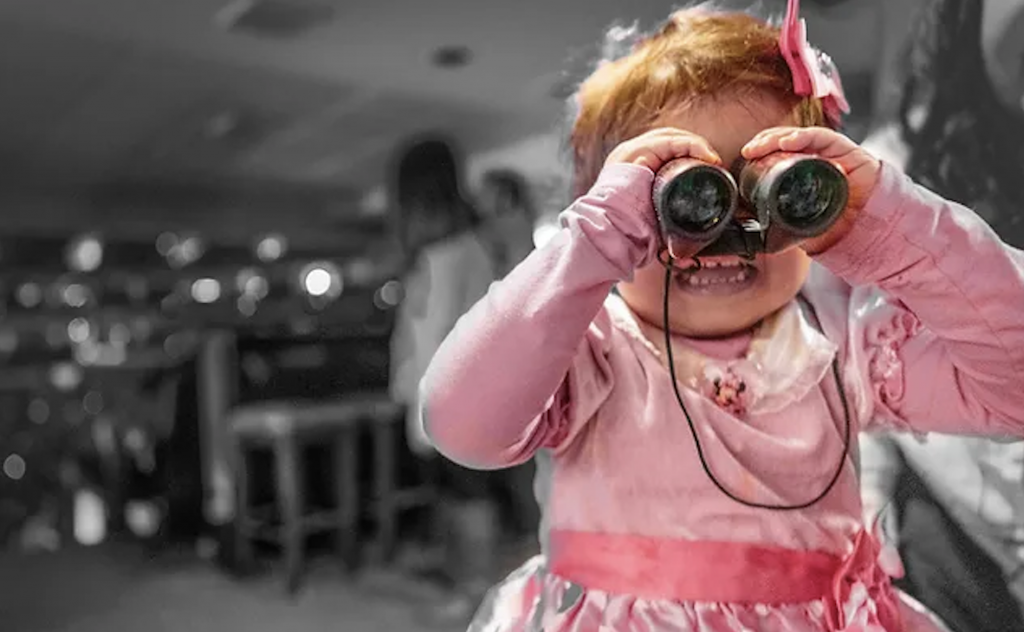 Girl with Binoculars Representing Media