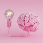 Brain with bulb on pink background
