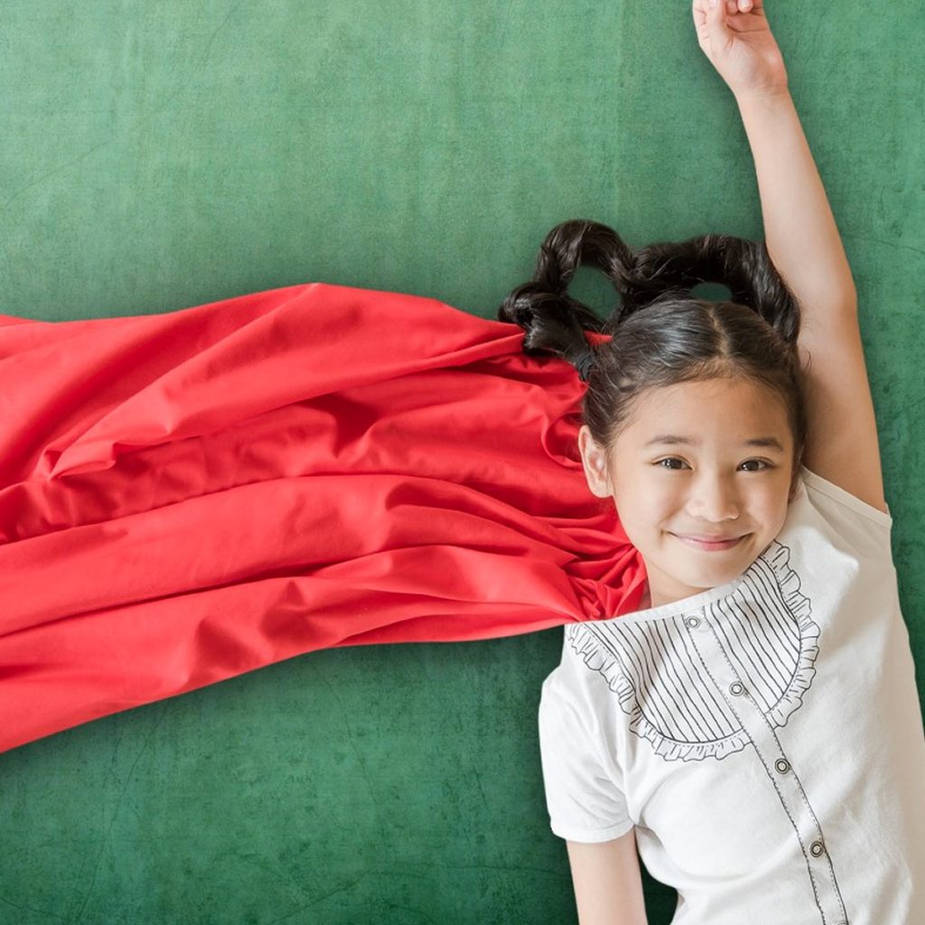 Girl with Red Cape over green background