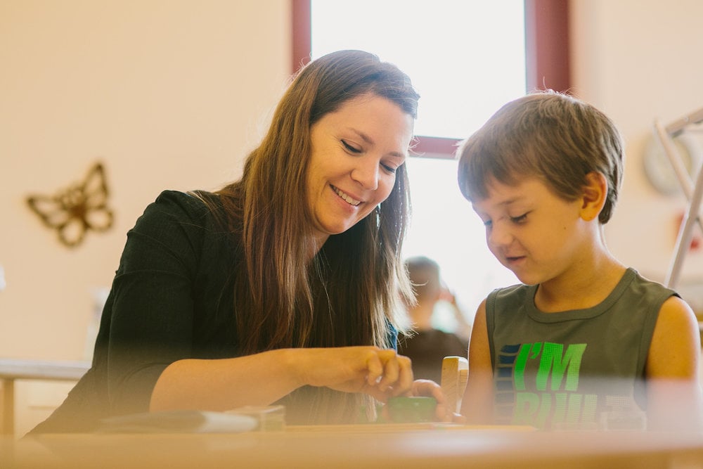 Montessori teacher with student