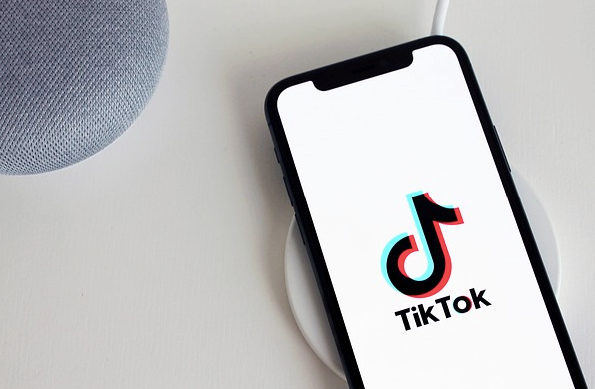 Image of a phone showing the TikTok logo.