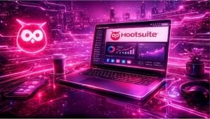 Hootsuite social media management dashboard displayed on a laptop with analytics charts and platform icons