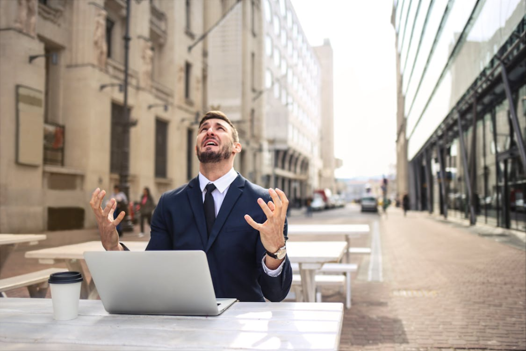 Man showing frustration while reviewing elaborate medical schema markup on his laptop.