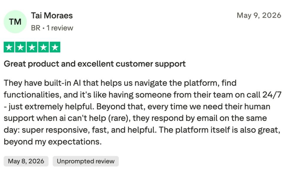 Five-star Trustpilot review from Tai Moraes praising Reply.io's built-in AI navigation and responsive human customer support.