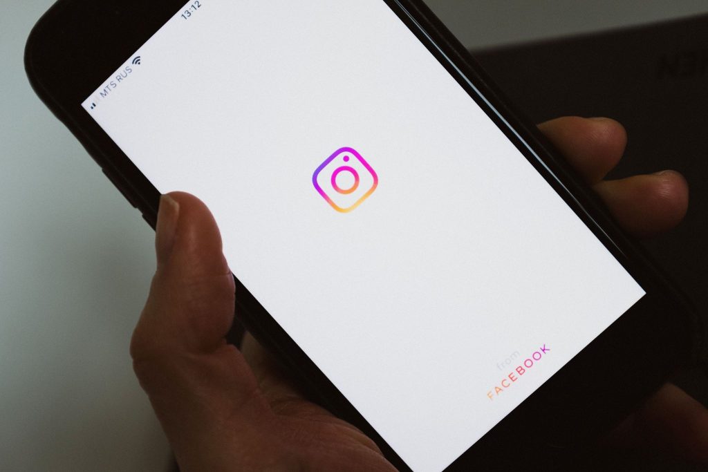 Person opening Instagram to post a story