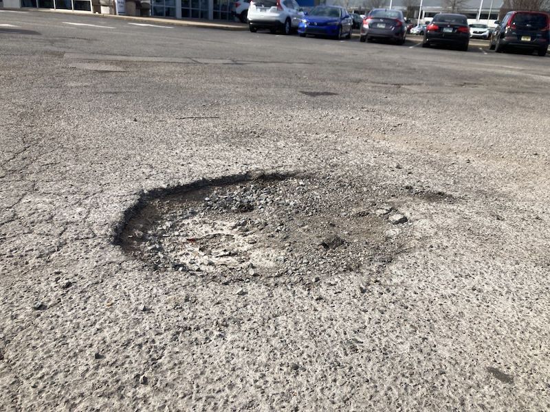 Nashville Hot Asphalt Contractor Fixes Cracks & Pot Holes In Your Parking Lot