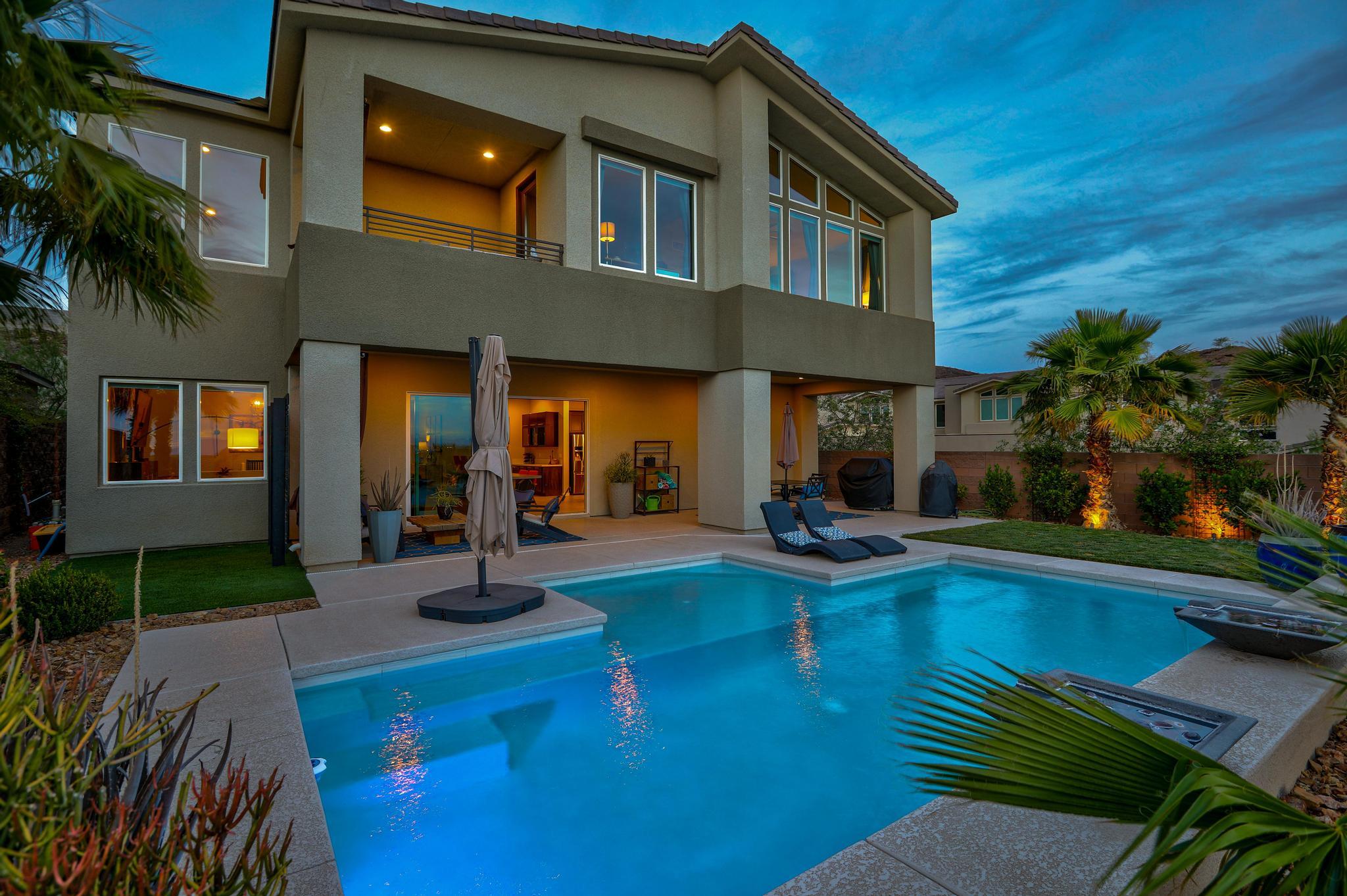 This 2-Story Home With Outside Pool Is Located In Gated Lake Las Vegas Community